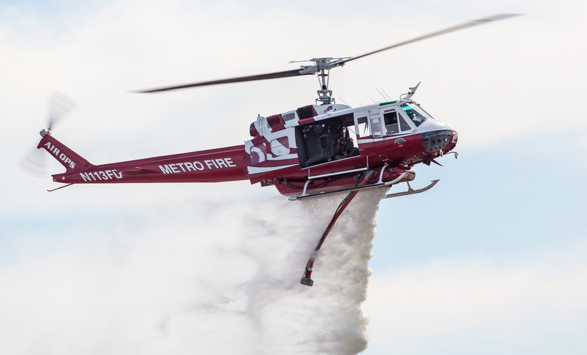 Metro Fire helicopter dropping water