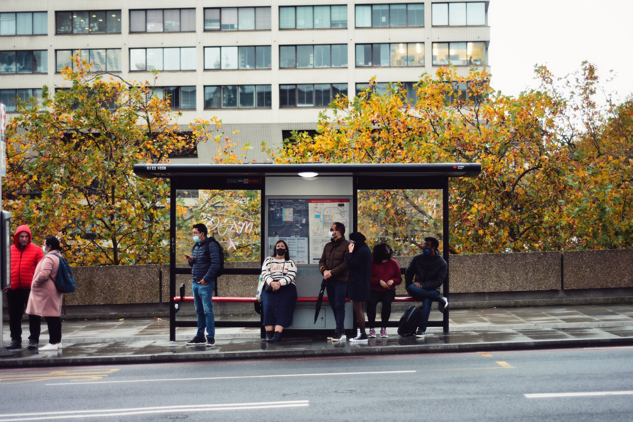 People at a bus stop